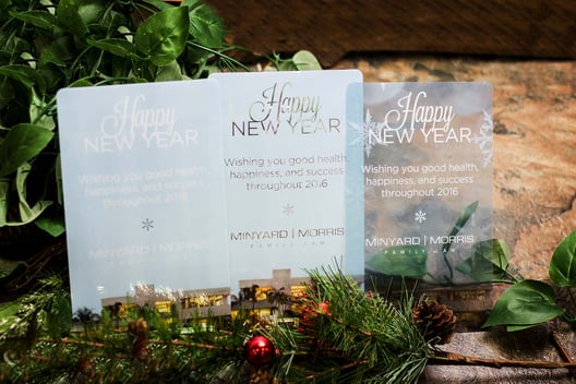 Example of 3 corporate holiday cards. Clear and transparent greeting cards for your clients, logo can be incorporated created by Plastic Printers, Inc.